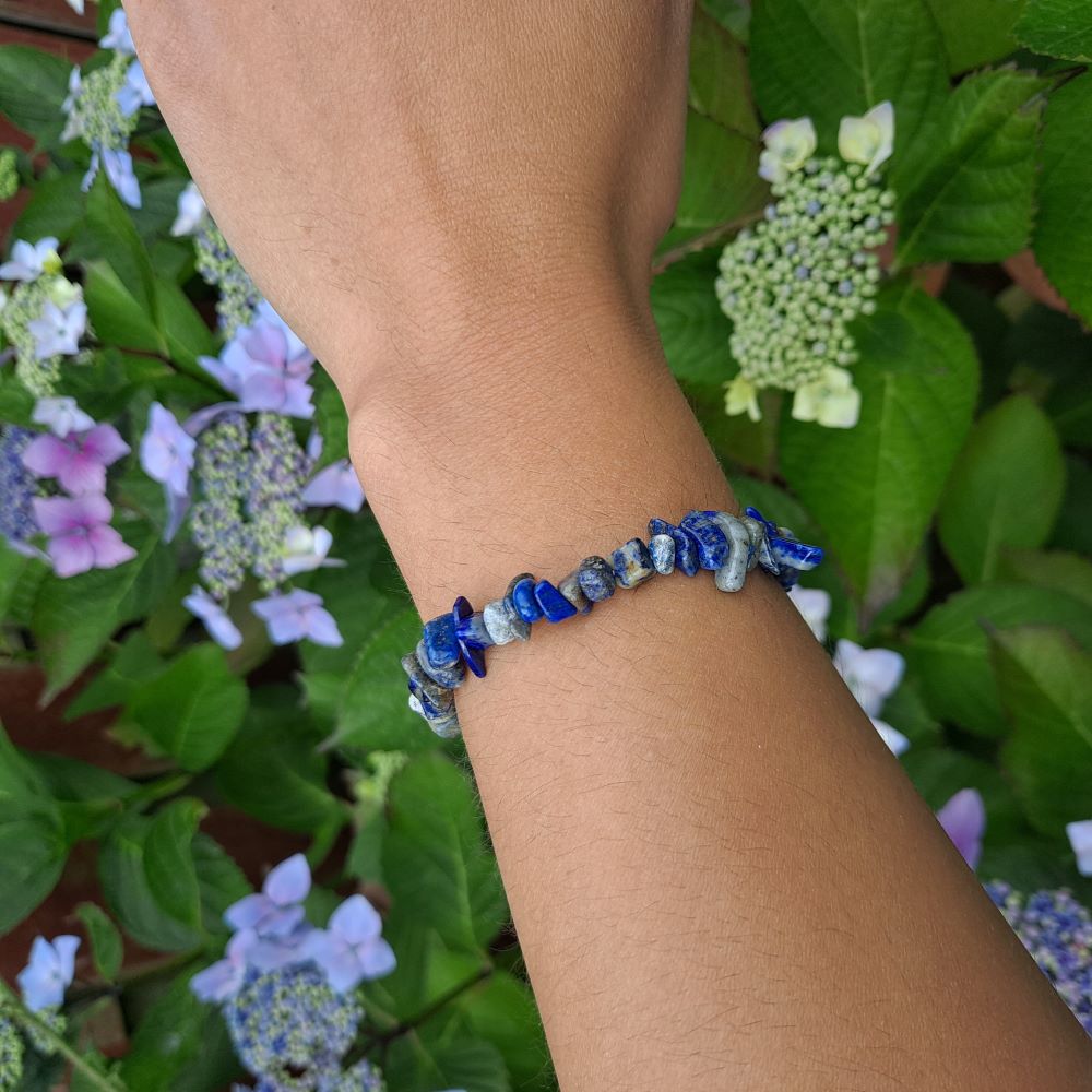 Dumi's Crystals | Lapis Lazuli Stretch Bracelet (Chip Beads) | Showcasing the captivating beauty of Lapis Lazuli on a wrist. This bracelet features a mesmerizing blend of deep blue hues and golden flecks, promoting wisdom, inner peace, and mental focus.