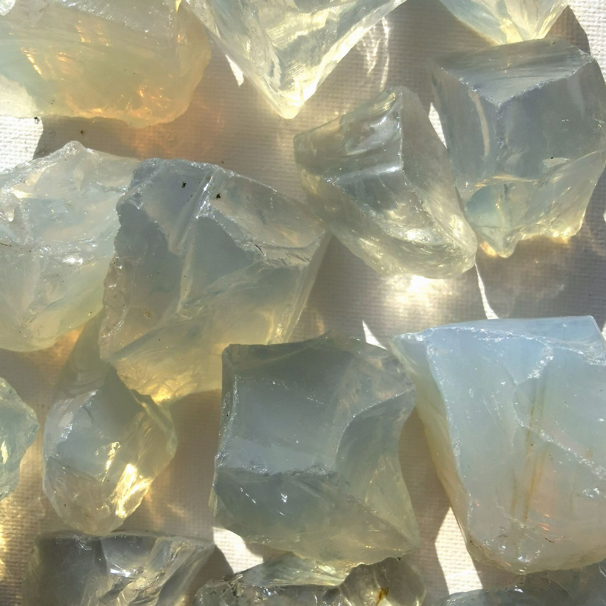 Dumi's Crystals | Rough Opalite Crystals (Healing & Creativity) | A collection of Rough Opalite Crystals, reminders of your inner light. Opalite fosters calmness, reduces negativity & enhances communication. Scatter them in your home or workspace to create a tranquil environment, boost creativity & welcome emotional healing. Embrace the power of Rough Opalite from Dumi's Crystals!