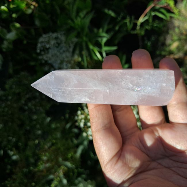 Dumi's Crystals | Rose Quartz Tower (7-10cm) | A close-up view of a captivating Rose Quartz Tower (7-10cm), showcasing its delicate pink hue and intricate patterns. This crystal is believed to promote love, compassion, and emotional healing.