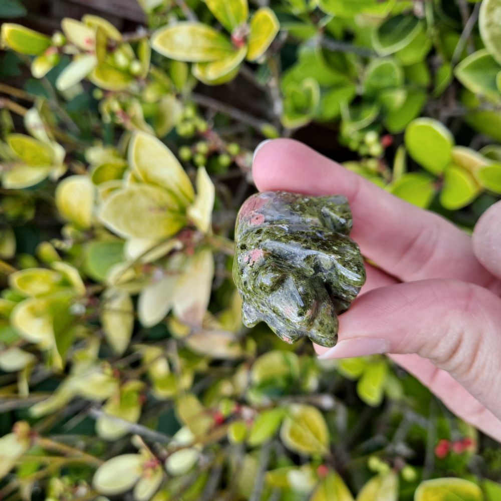 Dumi's Crystals | Unakite Bear Carving (Gentle Strength):  A close-up of a Unakite Crystal Bear Carving, showcasing its captivating green and pink hues. Hand-carved with love, this symbol of emotional balance & healing radiates gentle strength. Embrace peace with Dumi's Crystals (ethically sourced).