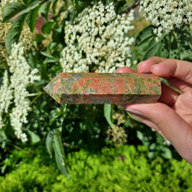 Dumi's Crystals | Unakite Tower (8-10cm) | A close-up view of a captivating Unakite Tower (8-10cm), showcasing its unique blend of green and pink hues. This crystal is believed to promote emotional balance, inner peace, and spiritual growth.