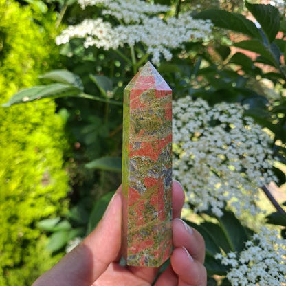 Unveil Harmony & Growth with Unakite Tower | Dumi's Crystals | This captivating Unakite Tower (8-10cm) radiates calming energy. Unakite is thought to foster emotional balance, spiritual awakening, and empower you to overcome challenges.